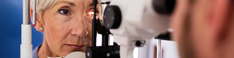 glaucoma concept - woman at eye doctor